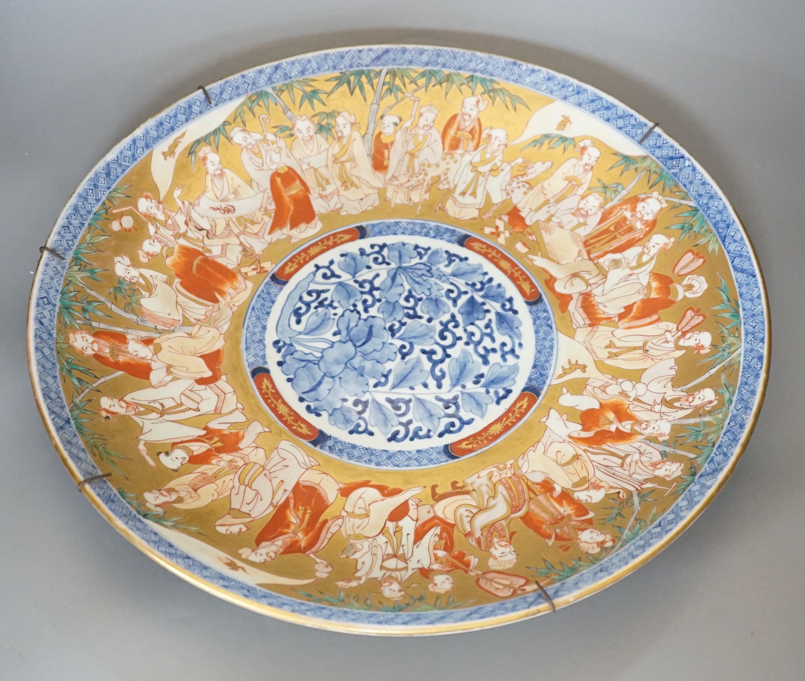 A large Japanese Imari ‘immortals’ dish - 46cm diameter